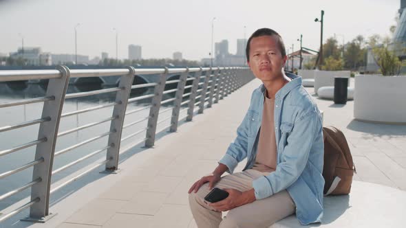 Portrait of Young Asian Man Outdoors
