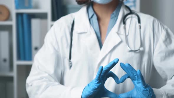 Doctor Doctor Girl Shows Fingers Heart Symbol Sign Heart Life A Medic In Gloves Stands In The Office