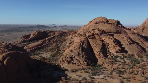 Massive rocky mountain with stunning desert on the background, Namibia