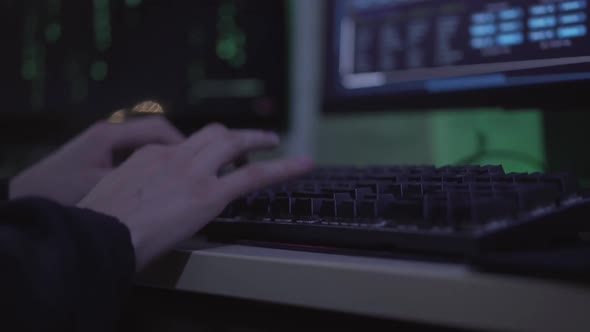 Close-up Hands of Young Caucasian Man Typing on Computer Keyboard. Unrecognizable Male Programmer