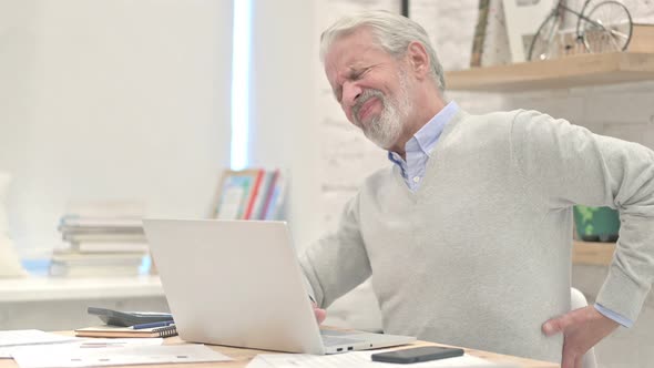 Old Man With Spinal Back Pain at Work