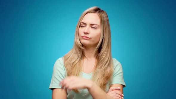 Blonde Woman Thinking Over Smart Idea Pondering Against Blue Background
