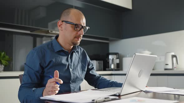 Businessman Having Video Call on Laptop in Home Office