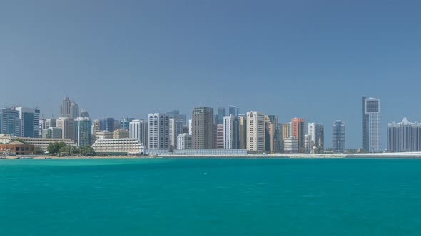 Modern Buildings in Abu Dhabi Skyline Timelapse with Mall and Beach