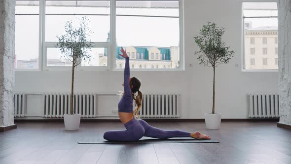 Yogi Woman Sitting in Ardha Kapotasana Pose