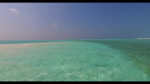 Aerial drone landscape of luxury lagoon beach voyage by turquoise sea with white sandy background of