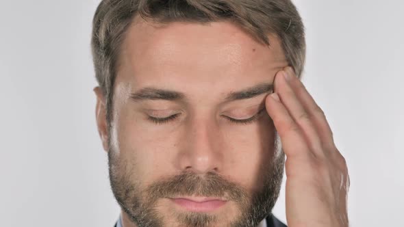 Close Up of Man Face Gesturing Headache Stress