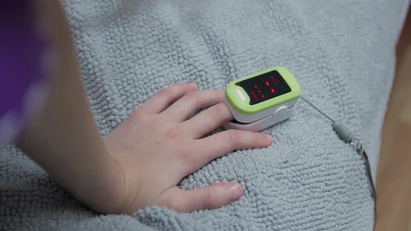 Oximeter On Girl Hand