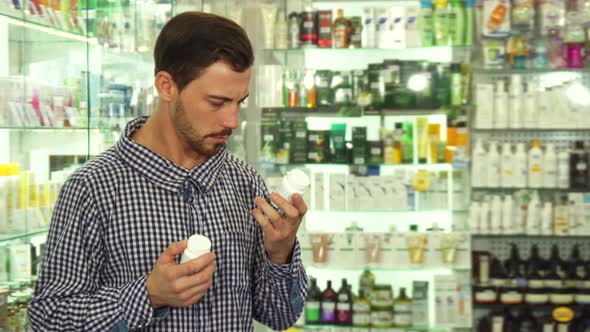 Man Hesitating Between Two Drugs