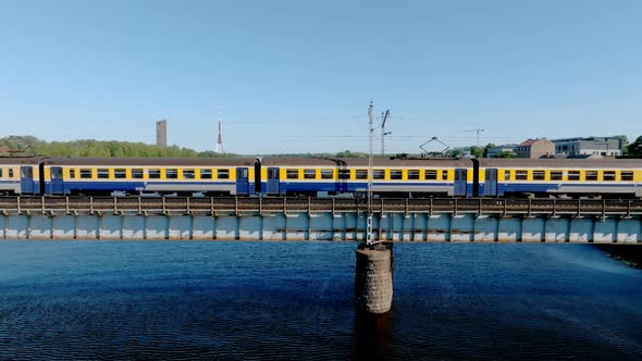 A Bridge Over River Daugava in Riga with a Train Passing By