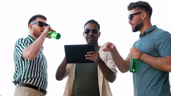 Men with Tablet Pc Drinking Beer on Rooftop