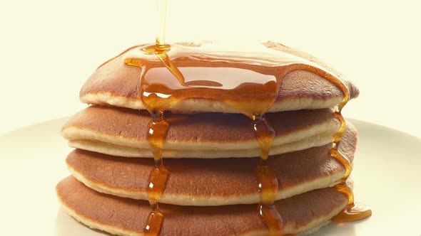 Pancakes Have Syrup Poured Over Them