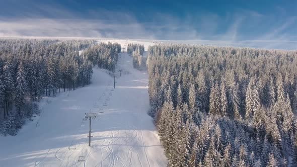 Aerial View of Closed Empty Cableway in Alpine Ski Resort in Beautiful Sunny Mountains Landscape