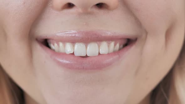 Close Up of Smiling Lips of Woman