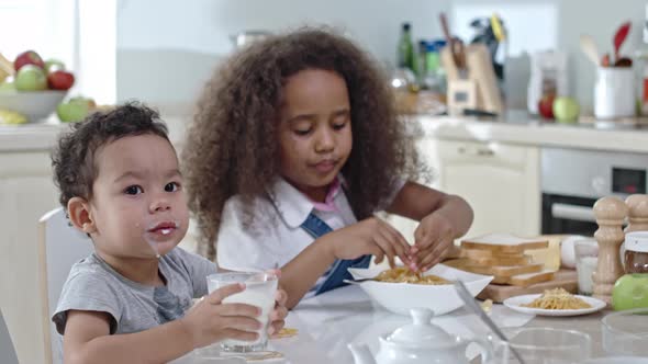 Child Making Mess at Dinner alt