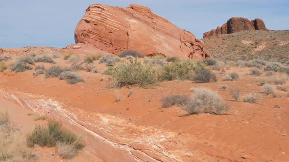 Driving On Highway In Sand Hot Desert With Red Orange Rock Formations Canyon