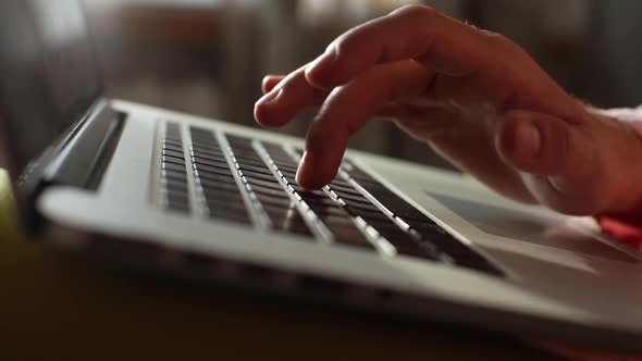 Extreme Closeup Hands of Unrecognizable Business Man Working Typing on Keyboard of Laptop Computer