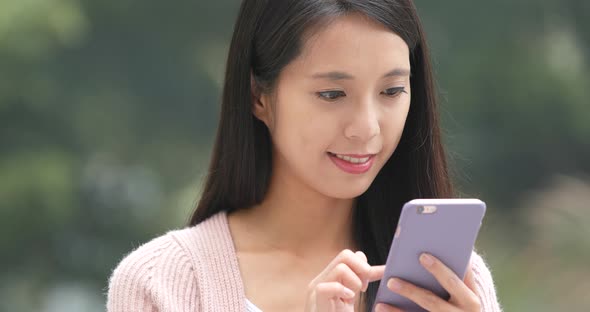 Woman using mobile phone at outdoor