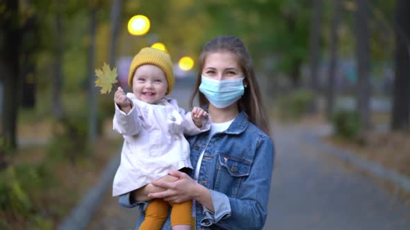 Masked Mother Holds Hand Lovely Daughter on Street Walk During Second Wave Quarantine Coronavirus