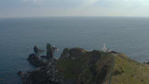 Aerial Shoot of A Lighthouse on The Coast Line with A Drone