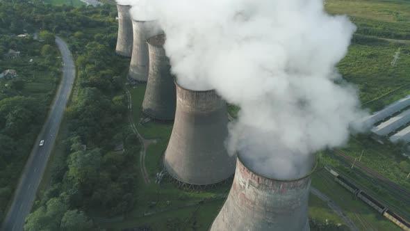 Aerial Drone View of Smoking Pipes and Cooling Towers of Coal Thermal Power Plant