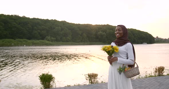 Romantic Black Woman with Basket Walk Near Lake