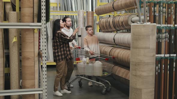 Family Shopping for Linoleum at Home Improvement Store