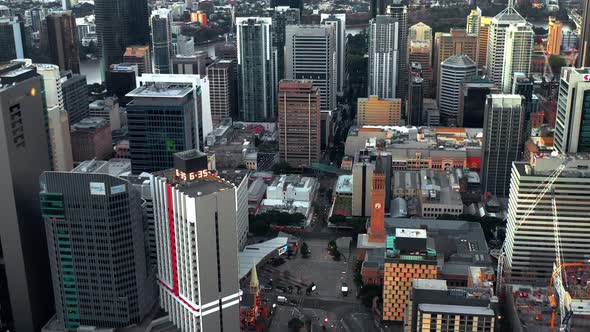 Fly Over King George Square Park With City Hall Clock Tower In Brisbane CBD, Queensland Australia. A