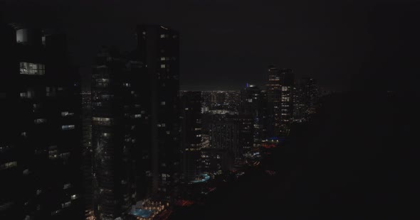 Aerial Reveal Buildings On The Ocean 5k Drone Night Video