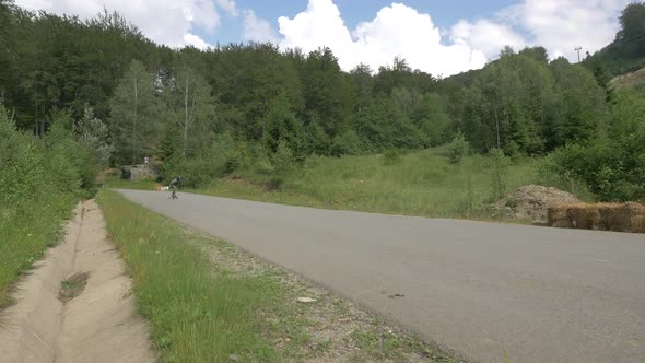 Longbaorders racing on a mountain road