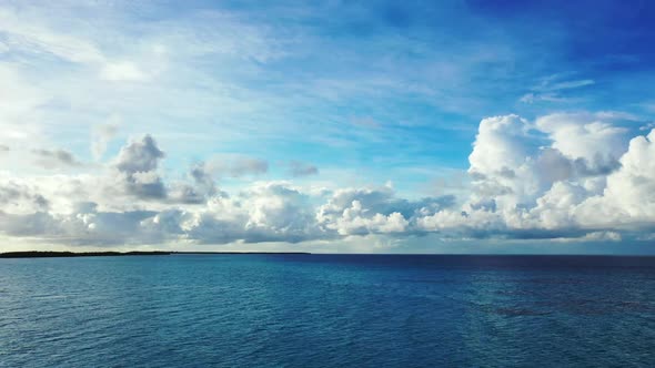 Aerial landscape of tropical coast beach voyage by blue water and white sandy background of a dayout