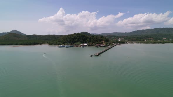 wide aerial of Laem Hin Pier in phuket thailand on a sunny day in the turquoise blue andaman sea