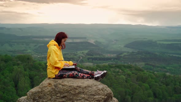 Woman Freelancer Works at Laptop on Top Mountain Backdrop Stunning Mountain