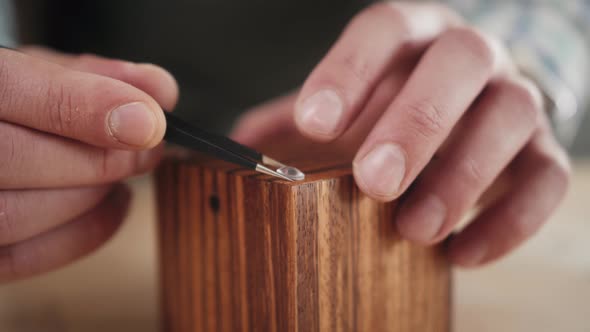Close Up of Carpenter's Hands Making Wooden Gift Box He Wants To Sell His Diy Ecommerce