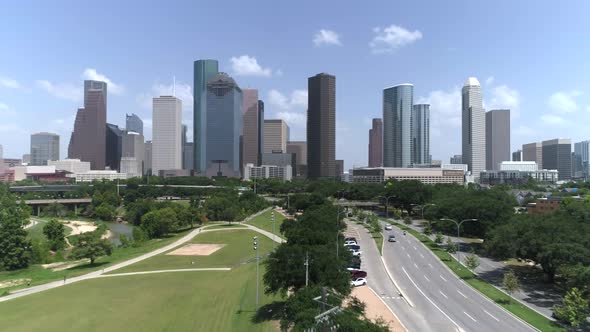 This video is about an aerial of downtown Houston skyline across from Elanor Tinsley Park. This vide