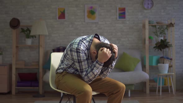 Man in Despair Clasps His Head Portrait of Depression