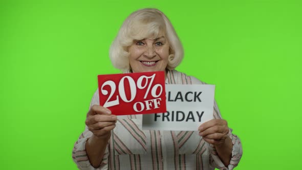 Senior Grandmother Showing Black Friday and 20 Percent Off Discount Advertisement Inscriptions