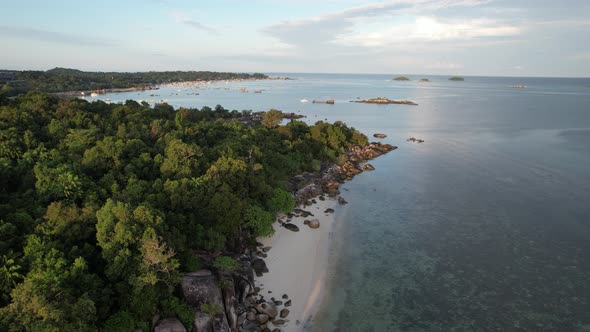 Tropical beach with sand and granite rock