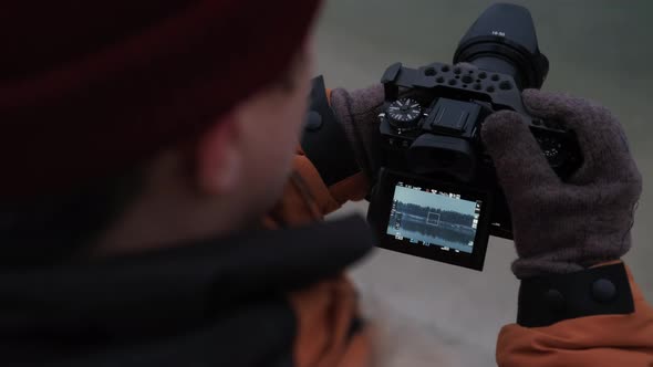 Close Up Camera in Hands Shooting Snowy Lake in Winter Forest