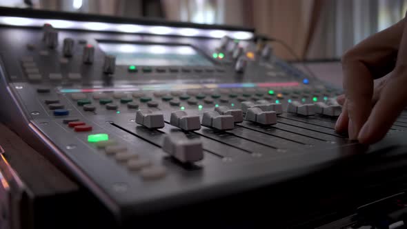 Close Up Footage of Hand Sound Producer Using a Music Mixer with Editing Tools in Concert