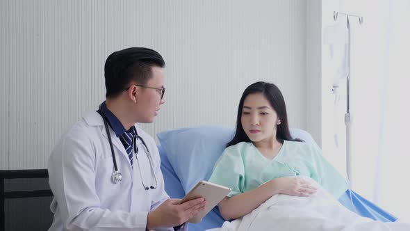 Asian doctor diagnosing female patient. Healthcare consultation concept