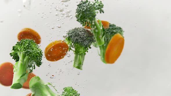 Mixed Veggies Carrots And Broccoli Splashing