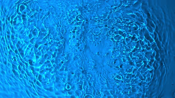 Super Slow Motion Abstract Shot of Splashing Blue Water Background at 1000Fps