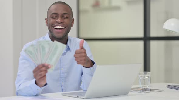 Thumbs Up By Happy African Man Showing Dollars