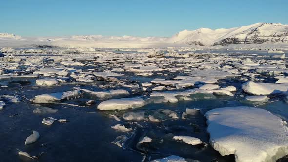 Severe icy river with rough snowy shores