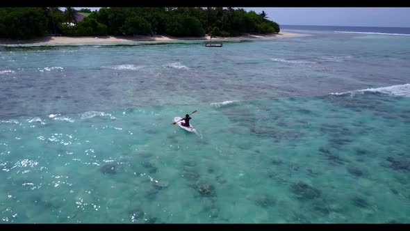 Aerial top view sky of exotic coastline beach holiday by blue lagoon with white sandy background of 