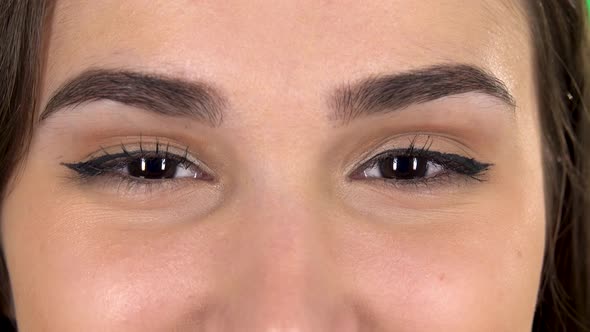 Close Up of Brown Beautiful Girl Eyes with Smile