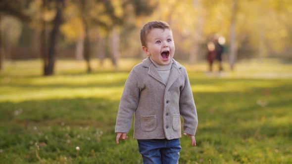 Laughing Boy in Autumn Park