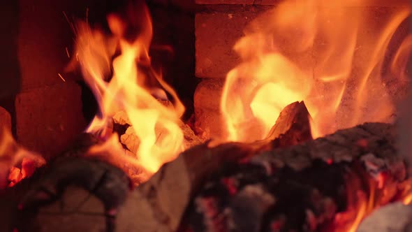 Firewood in oven and fireplace wood. Burning fire, firewood in fireplace