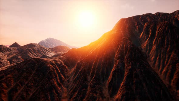 Sun Rays Over Mountains in a Valley alt